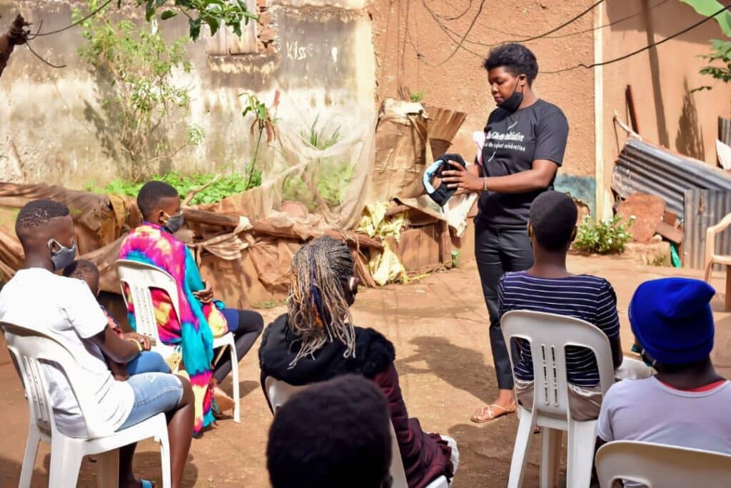 Rise Ghetto Team Member demonstrates use and care of reusable sanitary pad
