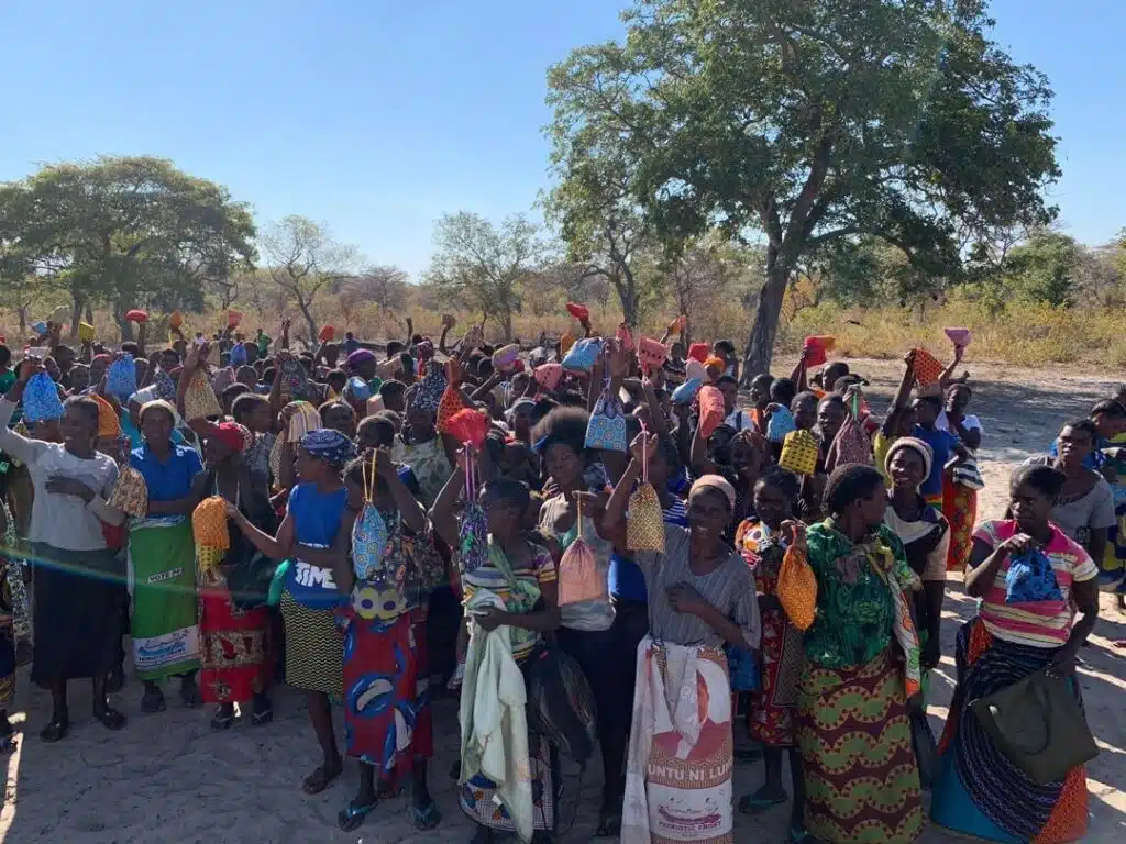 Group of women in Zambia carrying their reusable sanitary pads