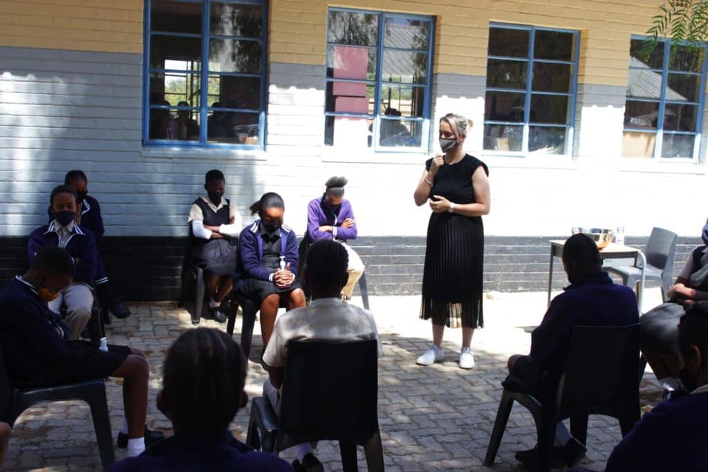 Phetogo BW official discussing menstrual health with schoolgirls in Botswana