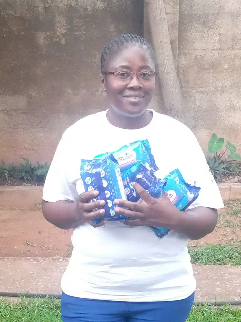 Zambian beneficiary carrying AFRIpads sanitary pads