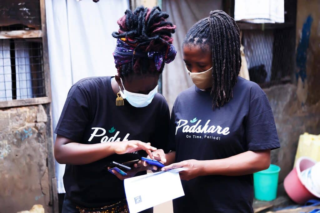 Sandra Awili, Founder of PADShare demonstrating how to use the PADShare app, a digital platform that simplifies sanitary pads distribution